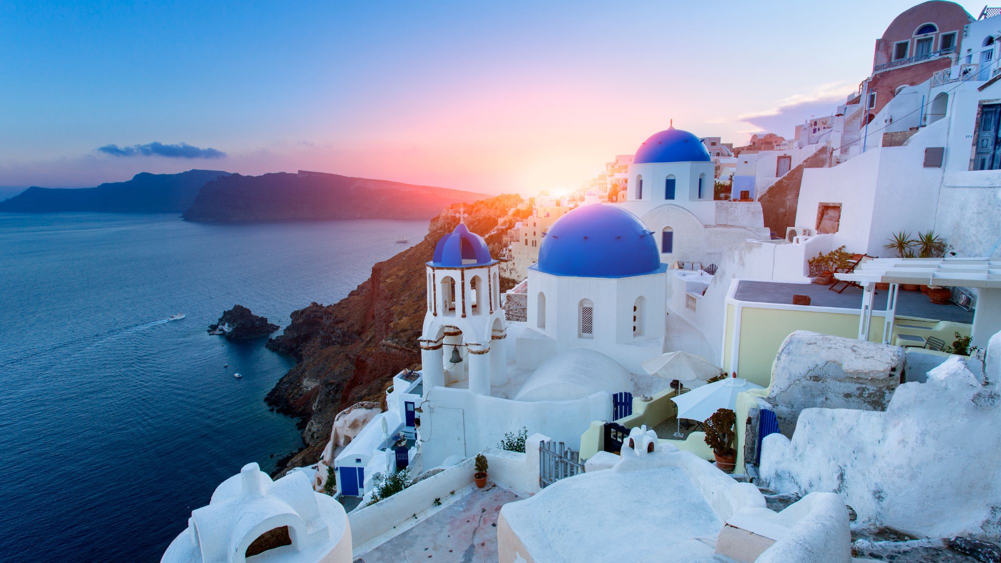 Santorini sunset with blue domes